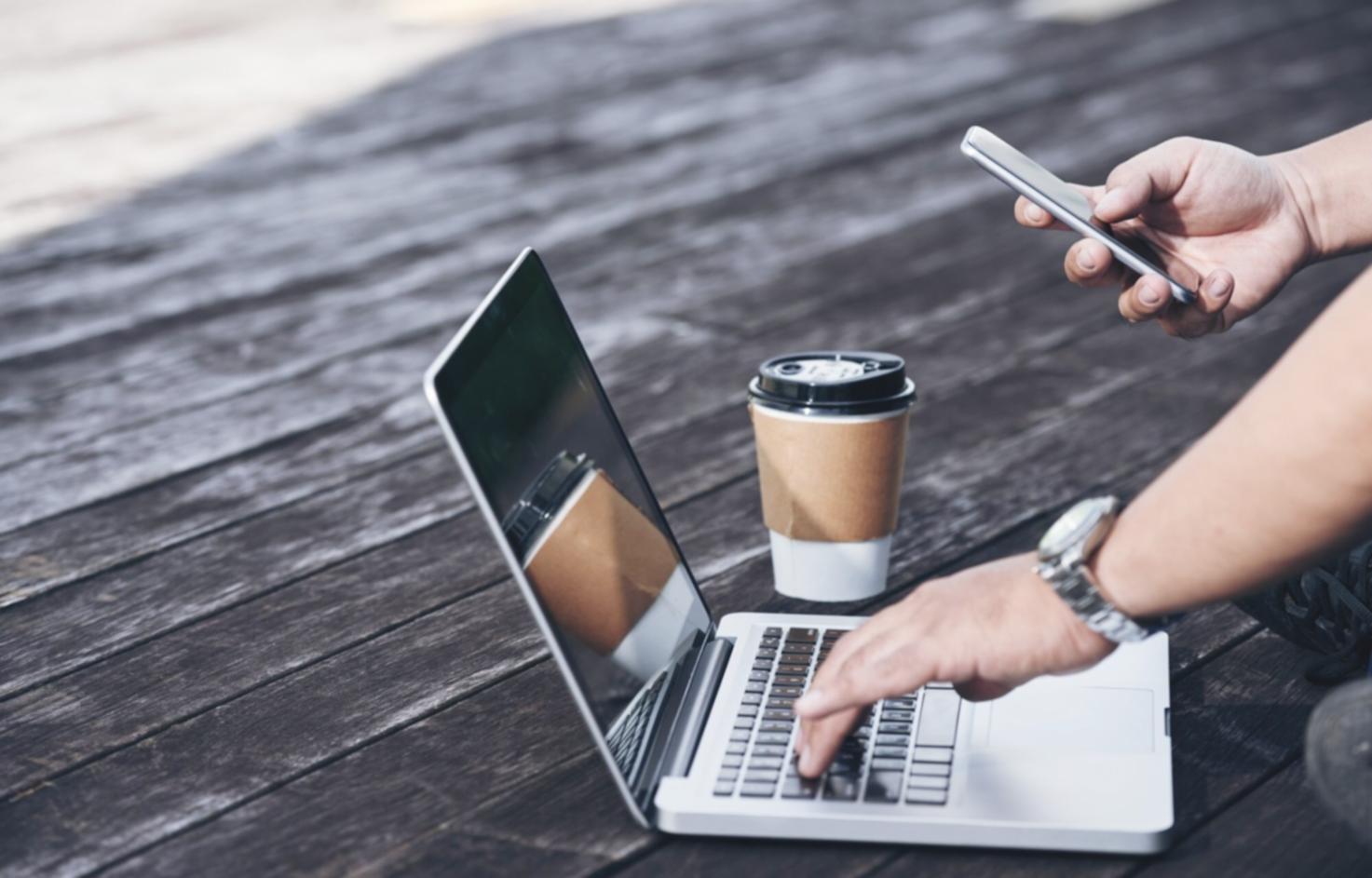 Testing laboratory with various mobile devices displaying different app interfaces and testing scenarios