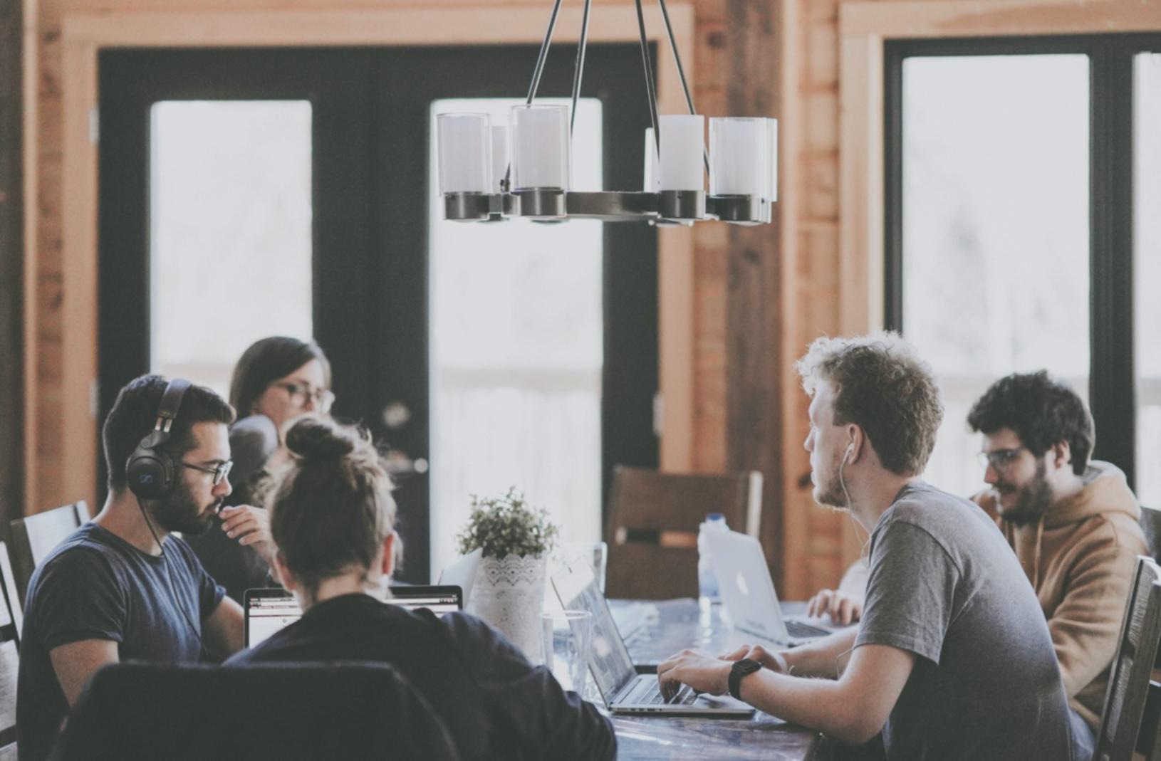 Students working on mobile testing projects in modern classroom setting